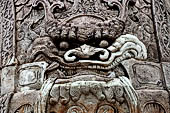 Bangkok Wat Pho, detail of the statue of chinese style door guardians of the gates of the walls of the temple.